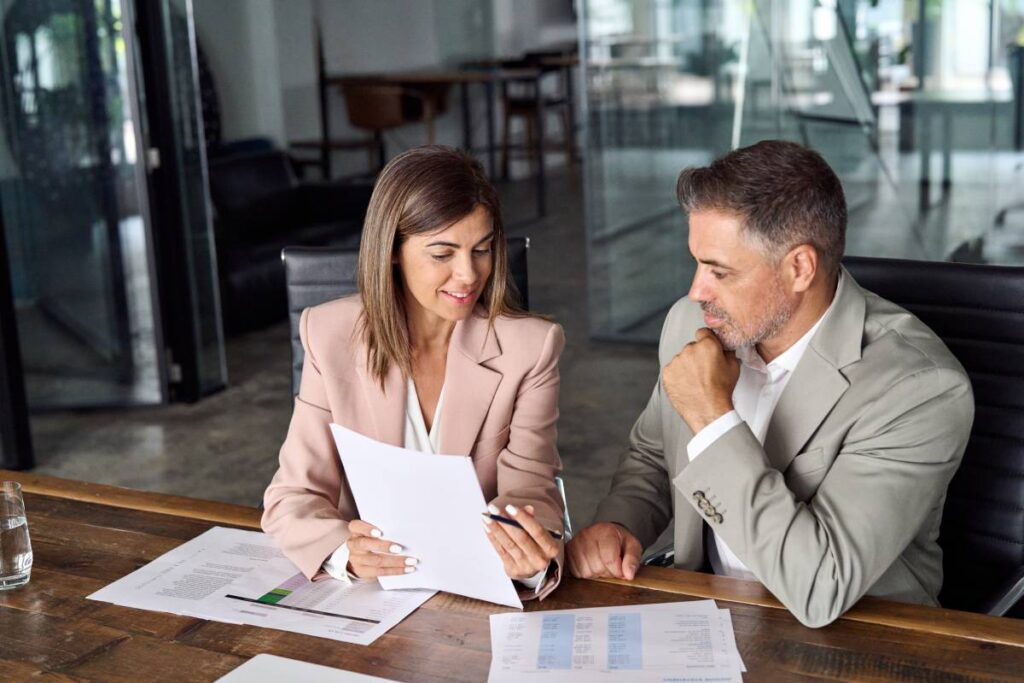 A lawyer goes over an escrow agreement with a client