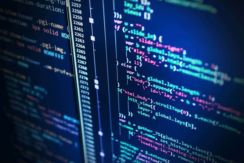 Colorful programming code on a laptop monitor.